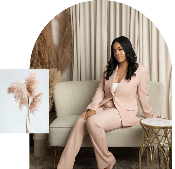 Woman in pink suit sitting on sofa.